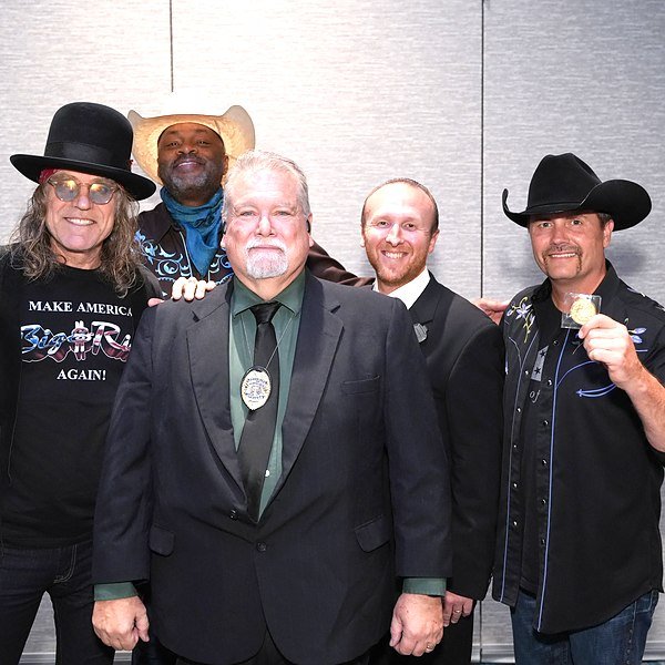 Kevin Jordan of American Central Force on protection detail with Big & Rich