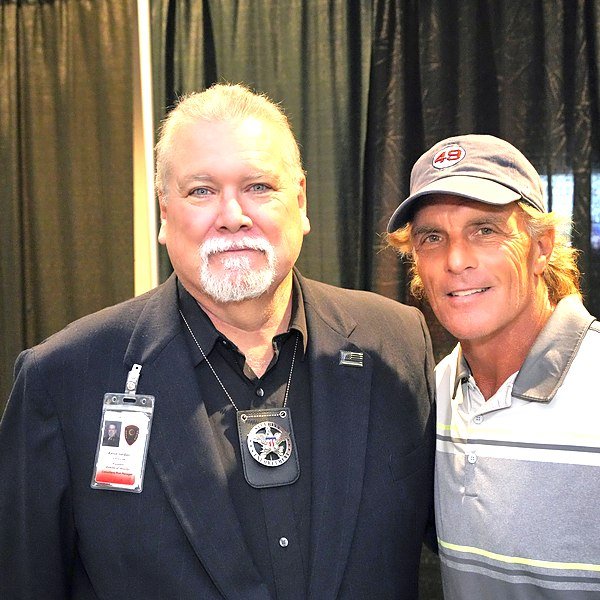 Kevin Jordan of American Central Force on protection detail with Doug Flutie
