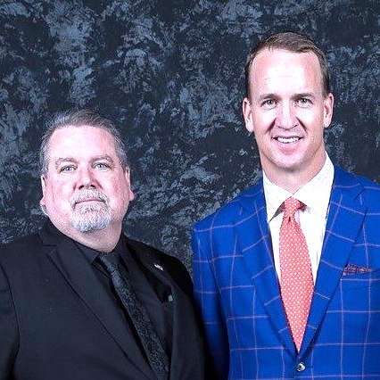Kevin Jordan of American Central Force on protection detail with Peyton Manning